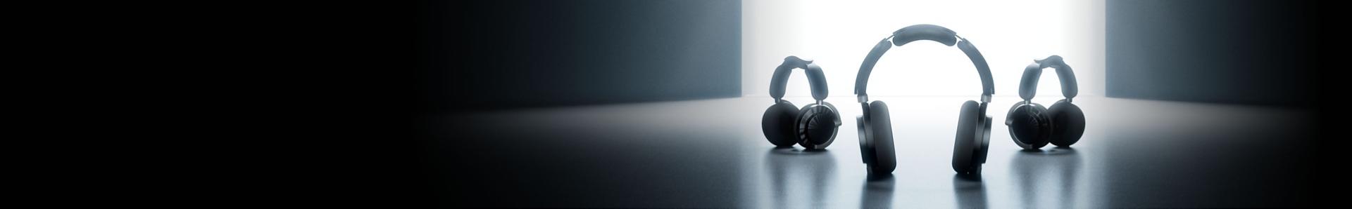 A lineup of sleek Dyson audio technology arranged in a dark room.