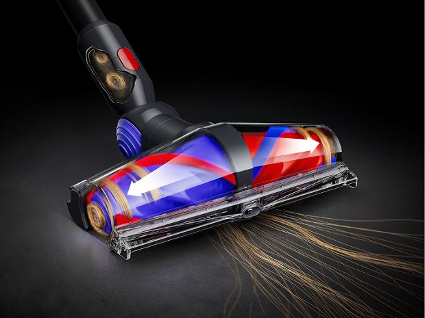 De-tangling conical cleaner head picking up long hair from the floor.