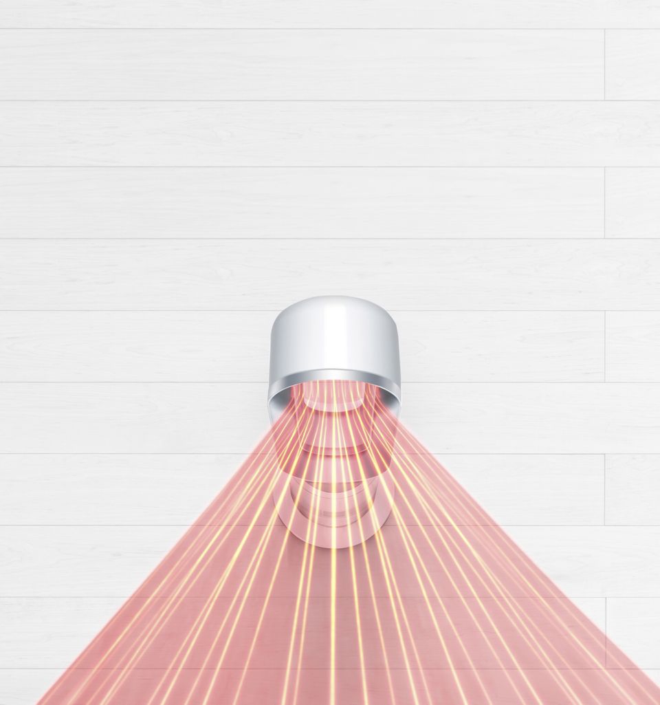 Vue à vol d’oiseau d’un ventilateur-chaufferette Dyson Hot+Cool projetant un flux d’air diffus.