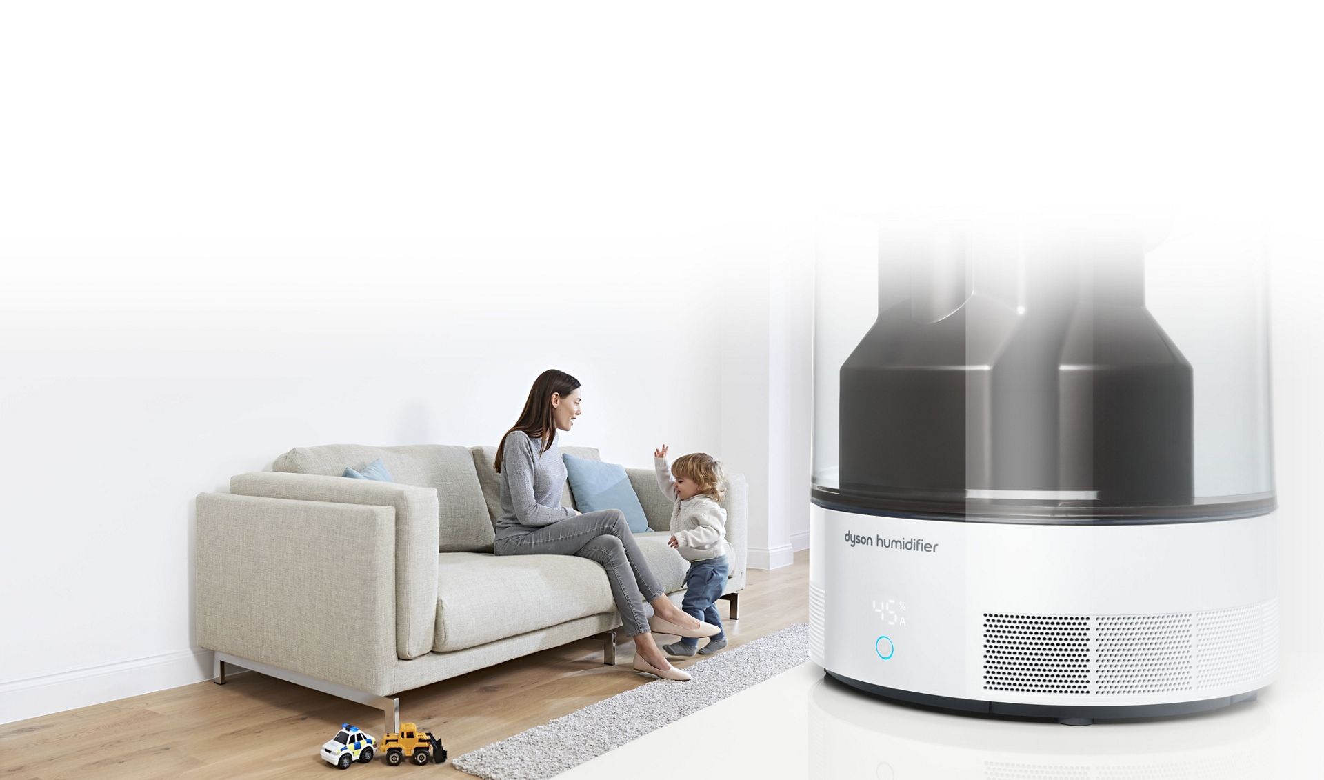 Dyson humidifer close up with mother and child in background