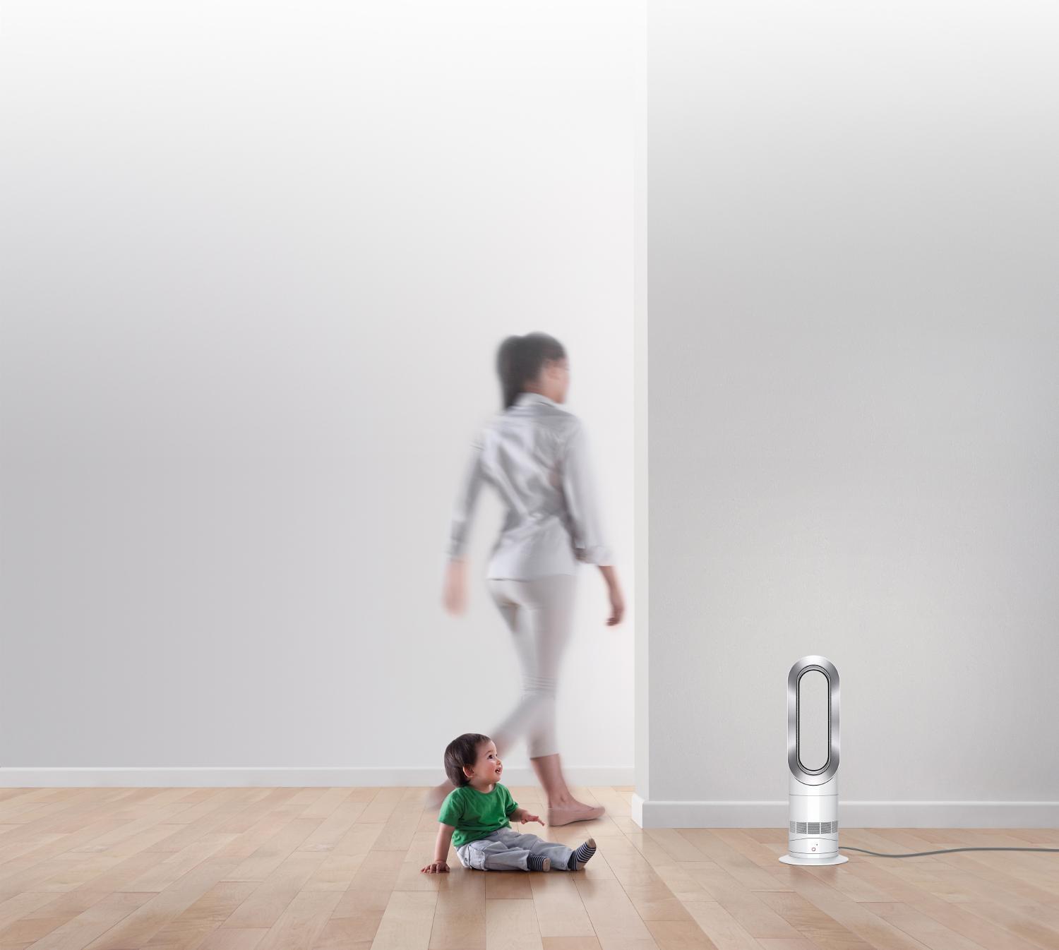 Child playing near Dyson fan heater