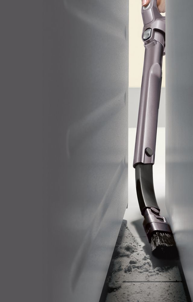 https://dyson-h.assetsadobe2.com/is/image/content/dam/dyson/countries/ca/service-and-support/support-home/tools/flexi-crevice-tool/flexi-crevice-tool-cleaning-between-fridge.jpg?$responsive$&cropPathE=mobile&fit=stretch,1&wid=640