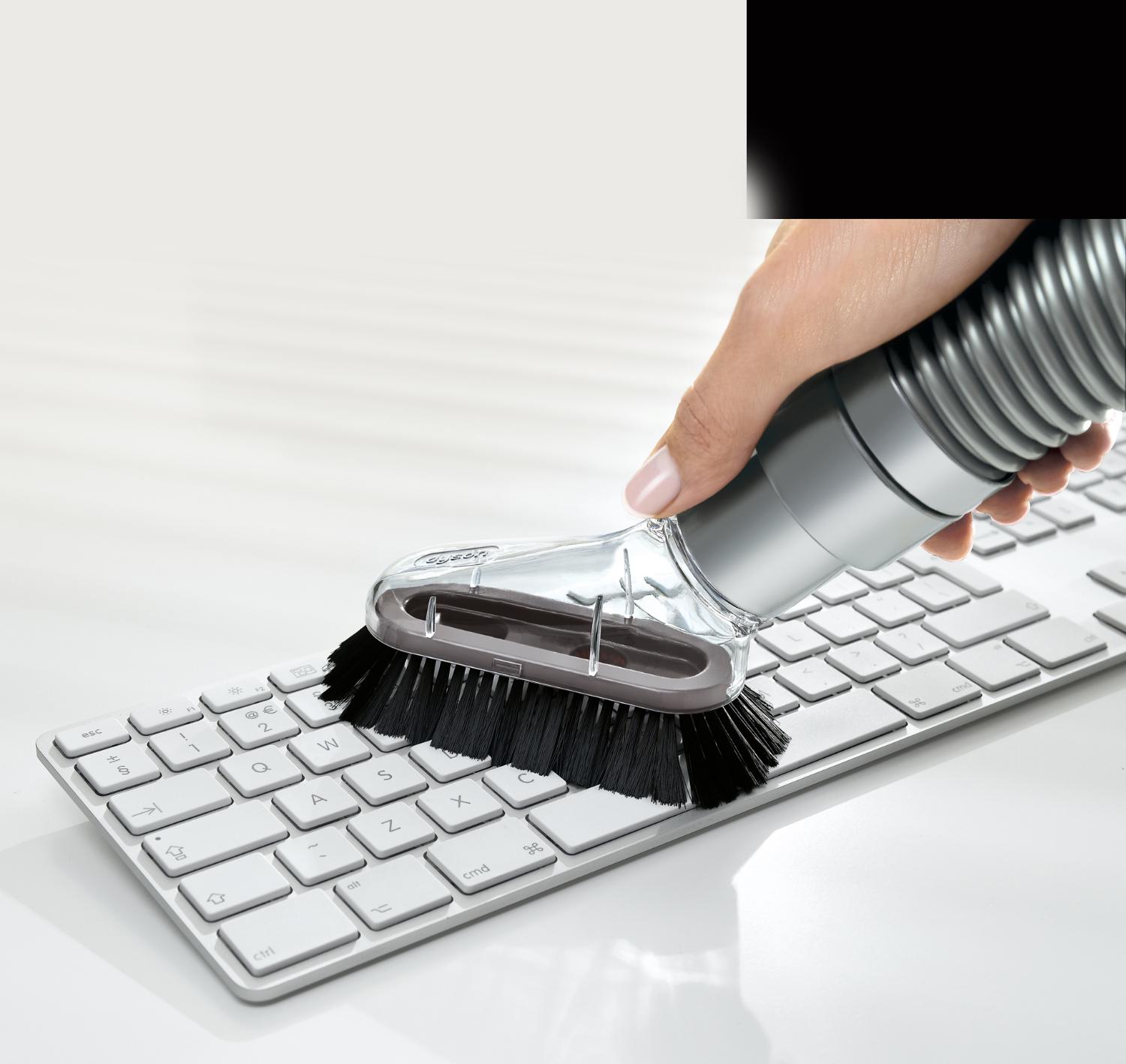 Mini soft dusting brush on keyboard.