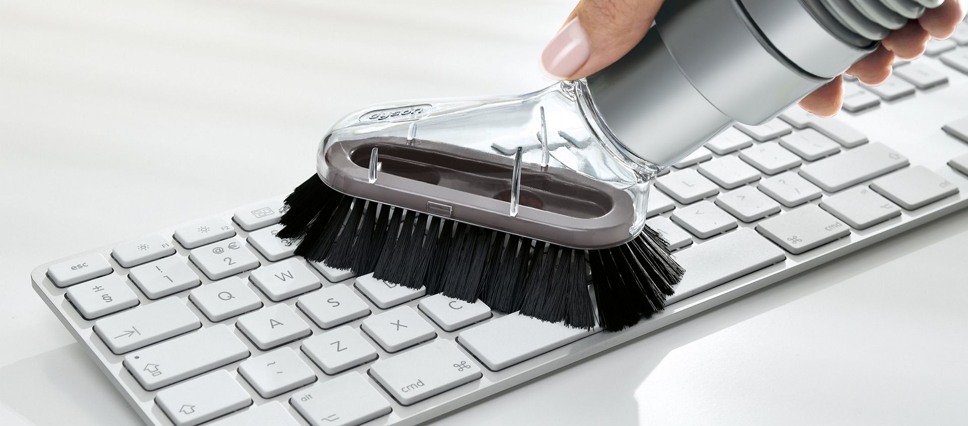 Mini soft dusting brush on keyboard.