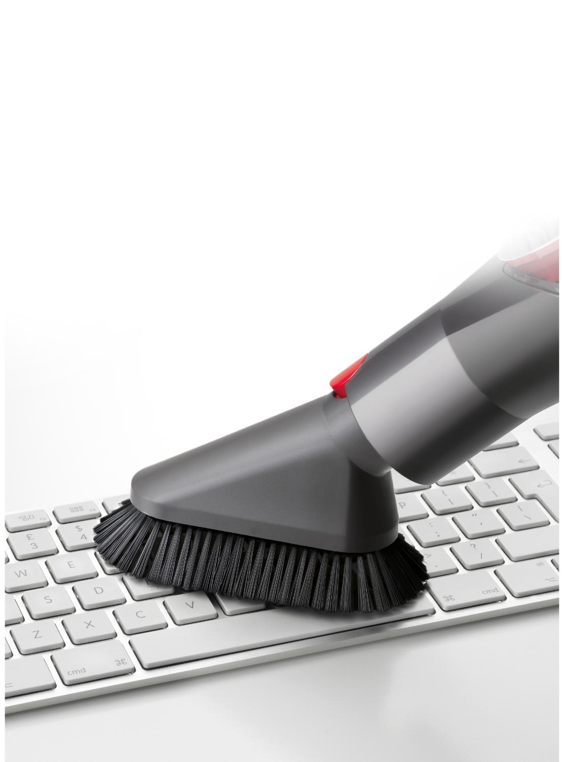 Close-up of Quick-release mini soft dusting brush on keyboard
