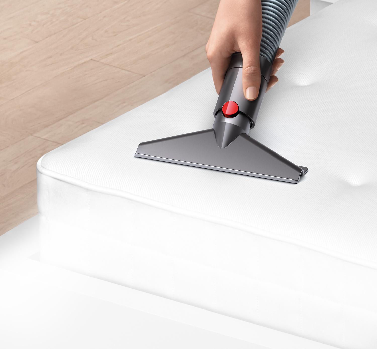 Close-up of wide nozzle tool on a sofa