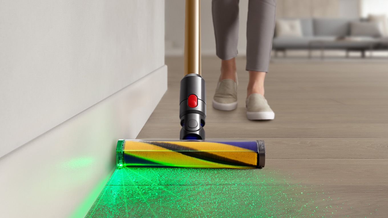 Dyson vacuum cleaner vacuuming floor with illumination