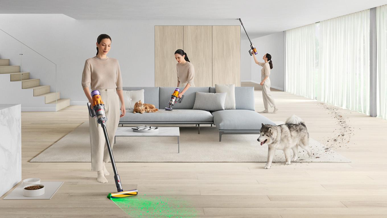 Dyson vacuum vacuuming living room