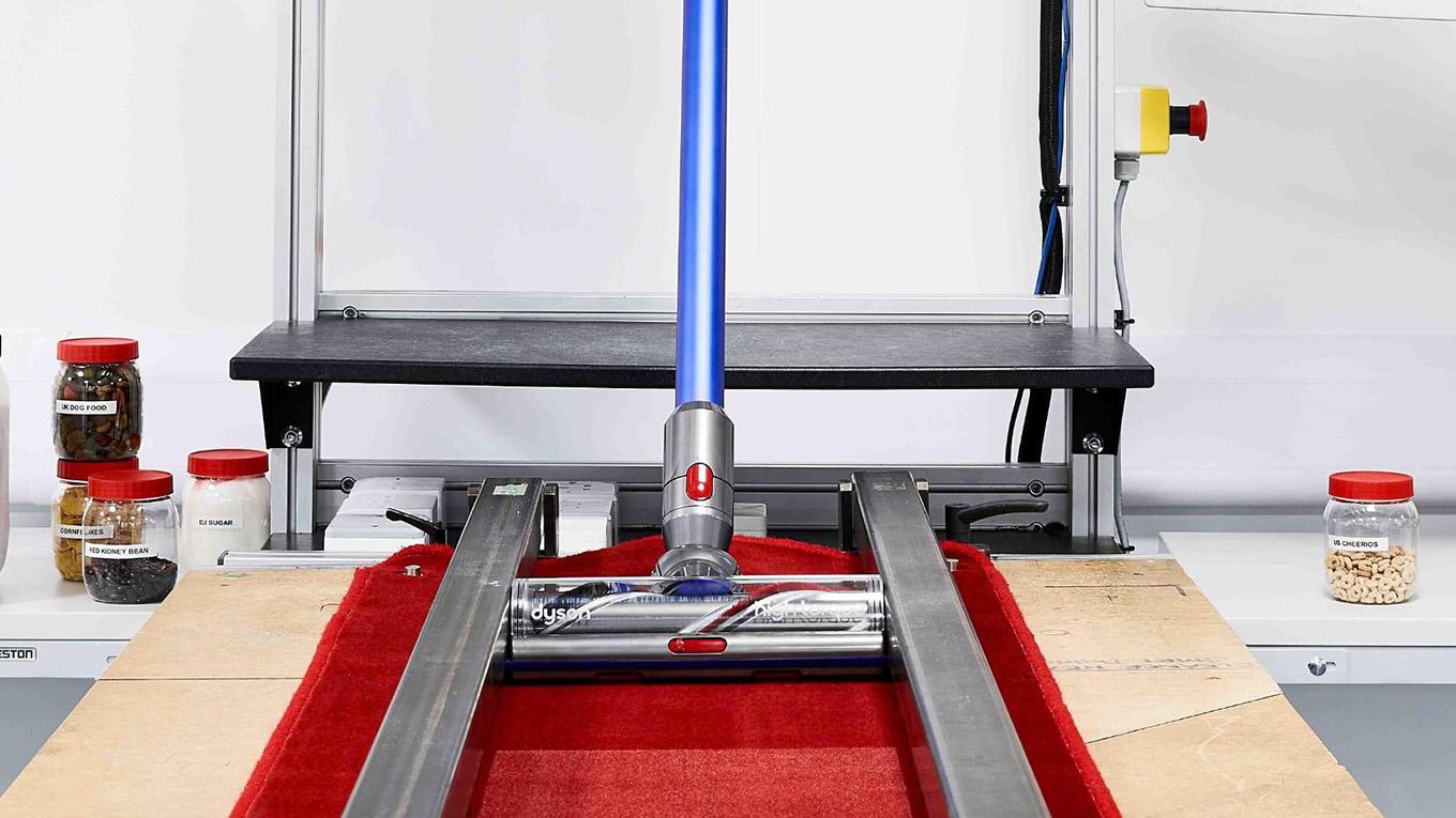 Dyson vacuum vacuuming carpet