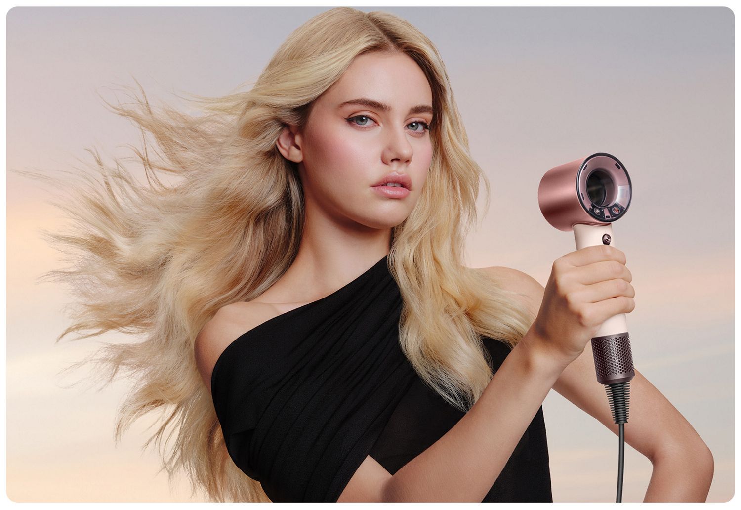 Dyson Supersonic Travel in the hand of a model