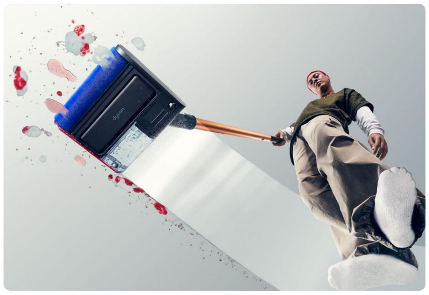 Dyson PencilWash cleaning a transparent floor with stains being removed