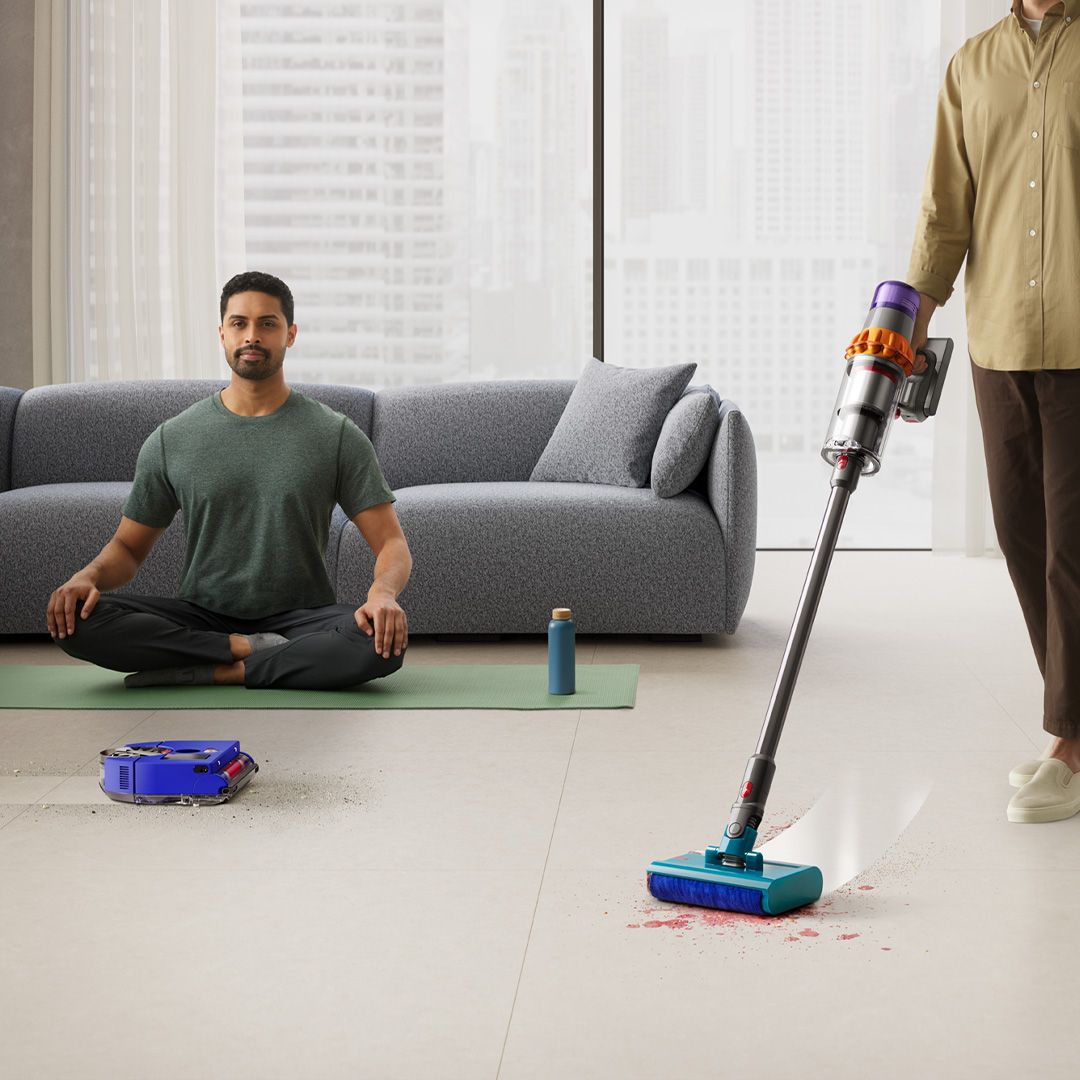 Dyson V15 Submarine and 360 Vis Nav vacuuming living room