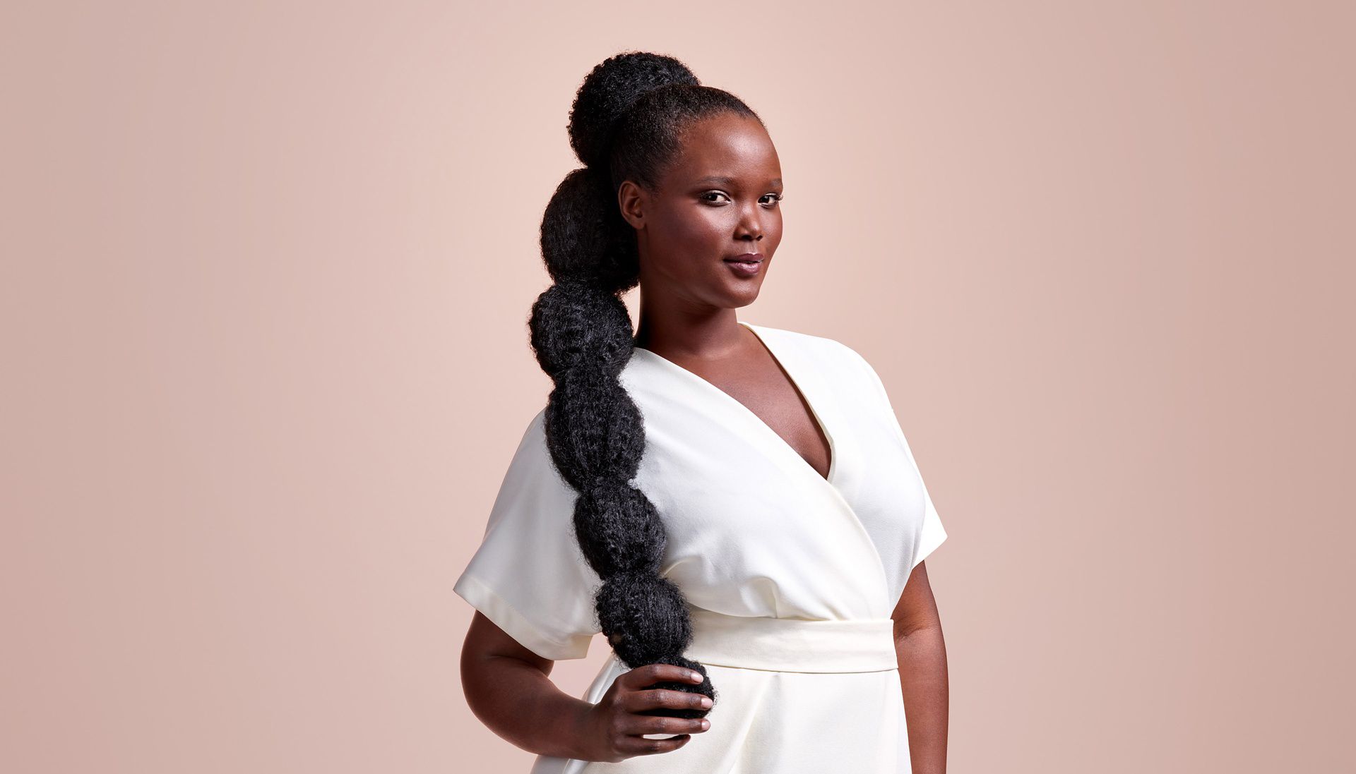 Hair styled into bubble braids.