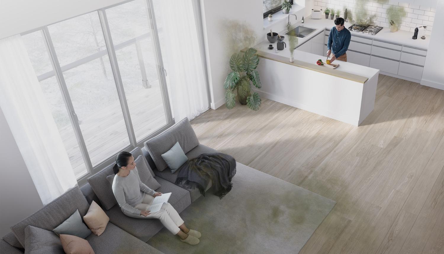 A high-angle view of a studio apartment with graphic overlays showing sources of pollution including a plant, a carpet, and a kitchen stove.