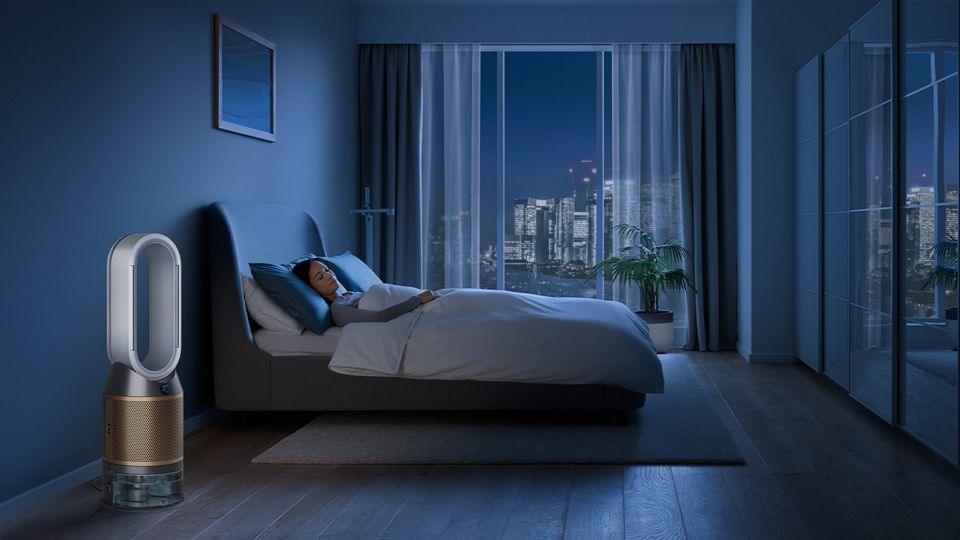 Dyson purifier by someone's bed at night while sleeping