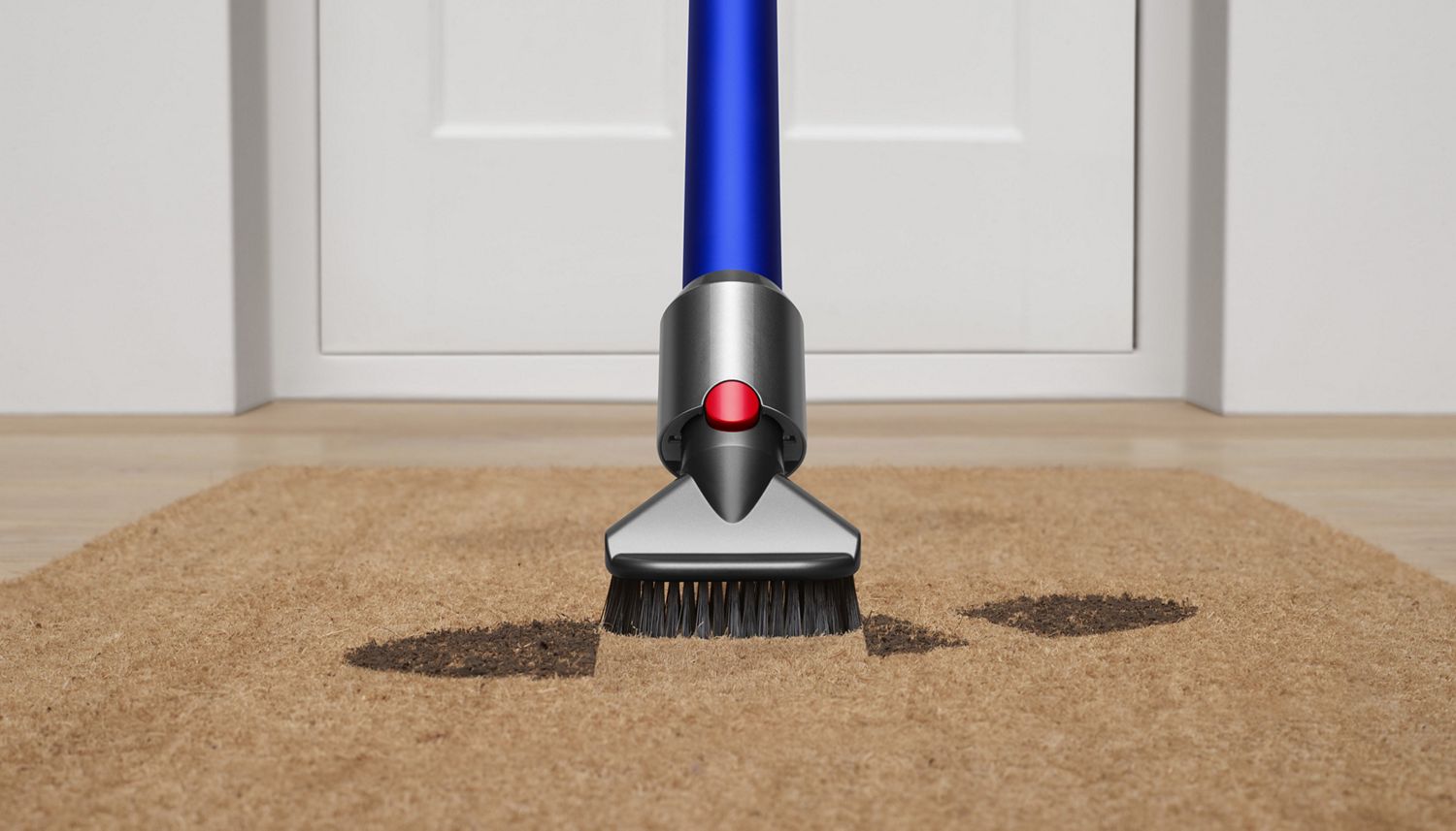 Dyson Stubborn dirt brush used to vacuum mud from doormat