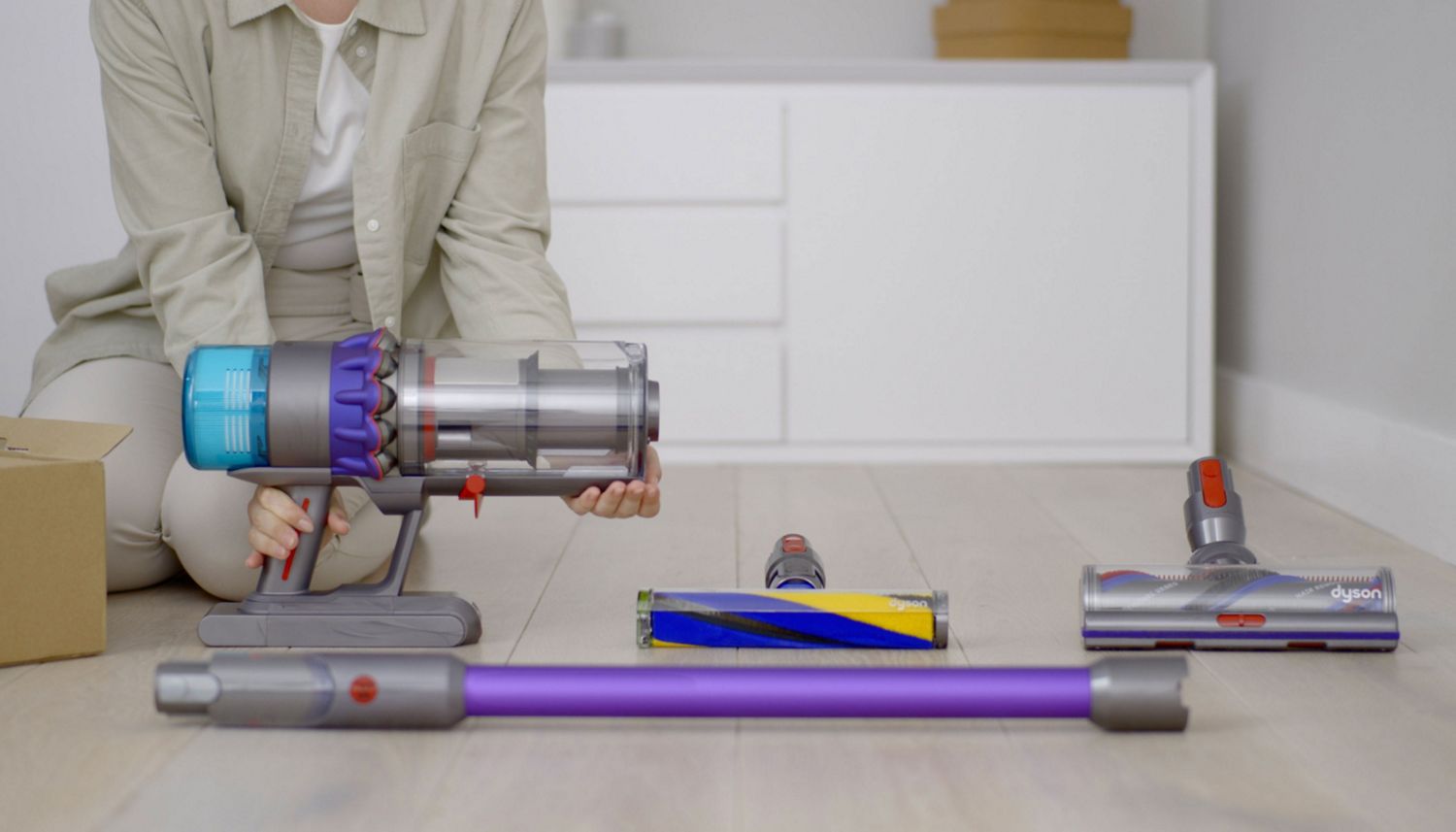 The owner of a Dyson vacuum lays out their machine and attachments ready for cleaning.