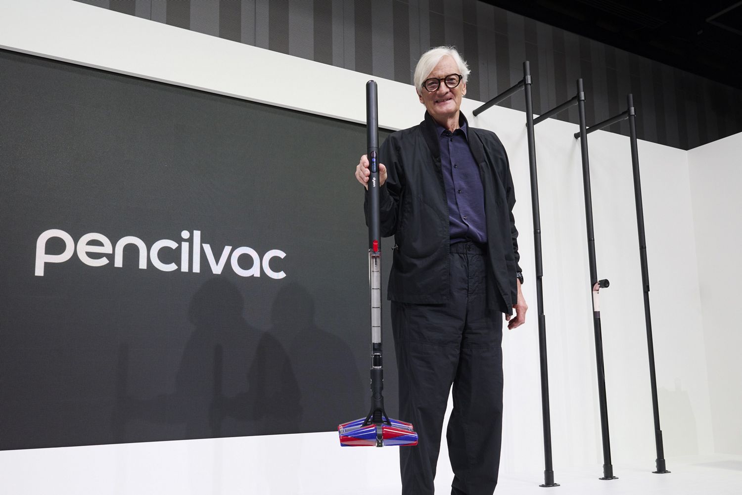James Dyson on stage with the Dyson PencilVac