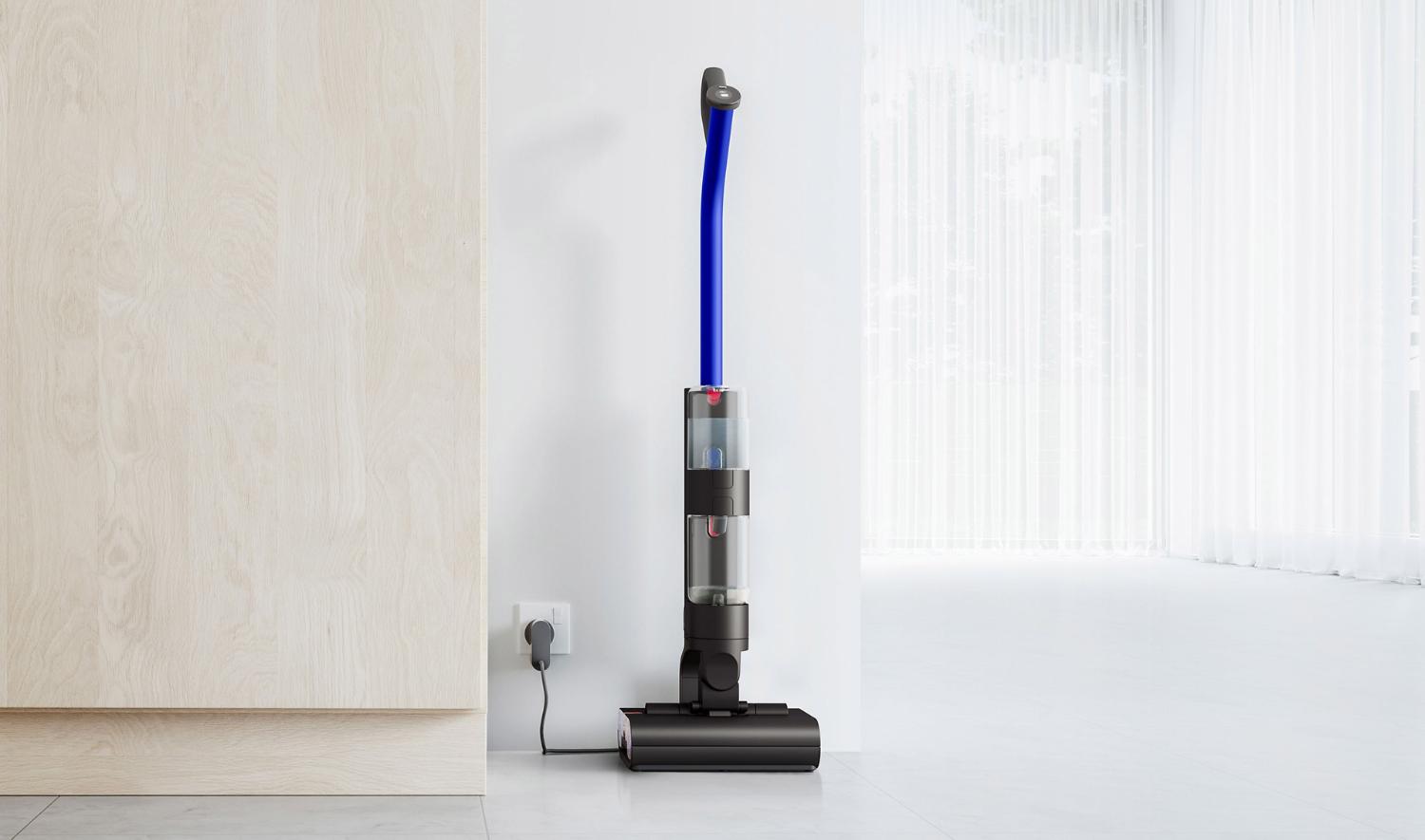 Dyson WashG1 wet cleaner charging on its dock and perfoming a self-clean cycle
