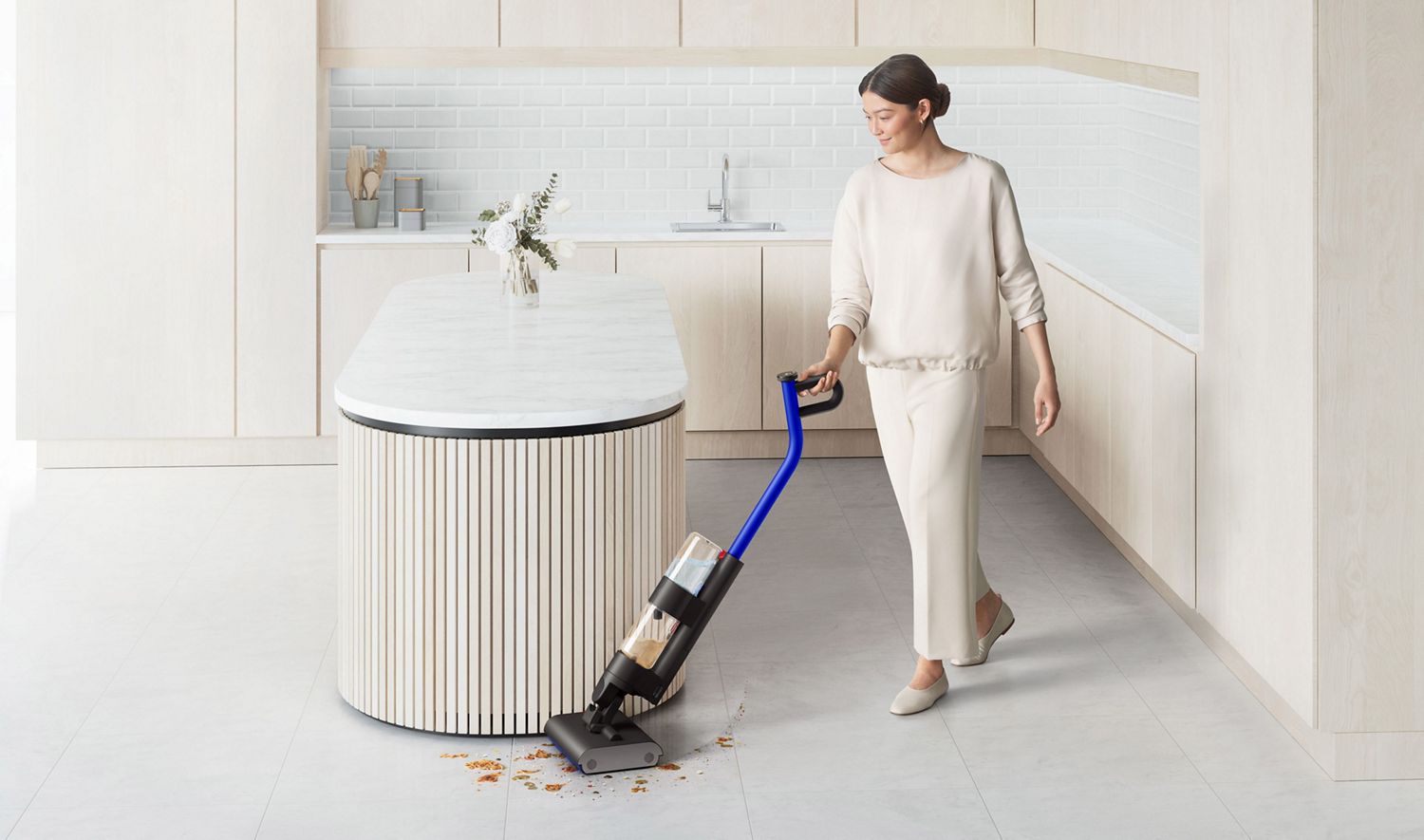 Dyson WashG1 used by woman to clean spills on kitchen floor