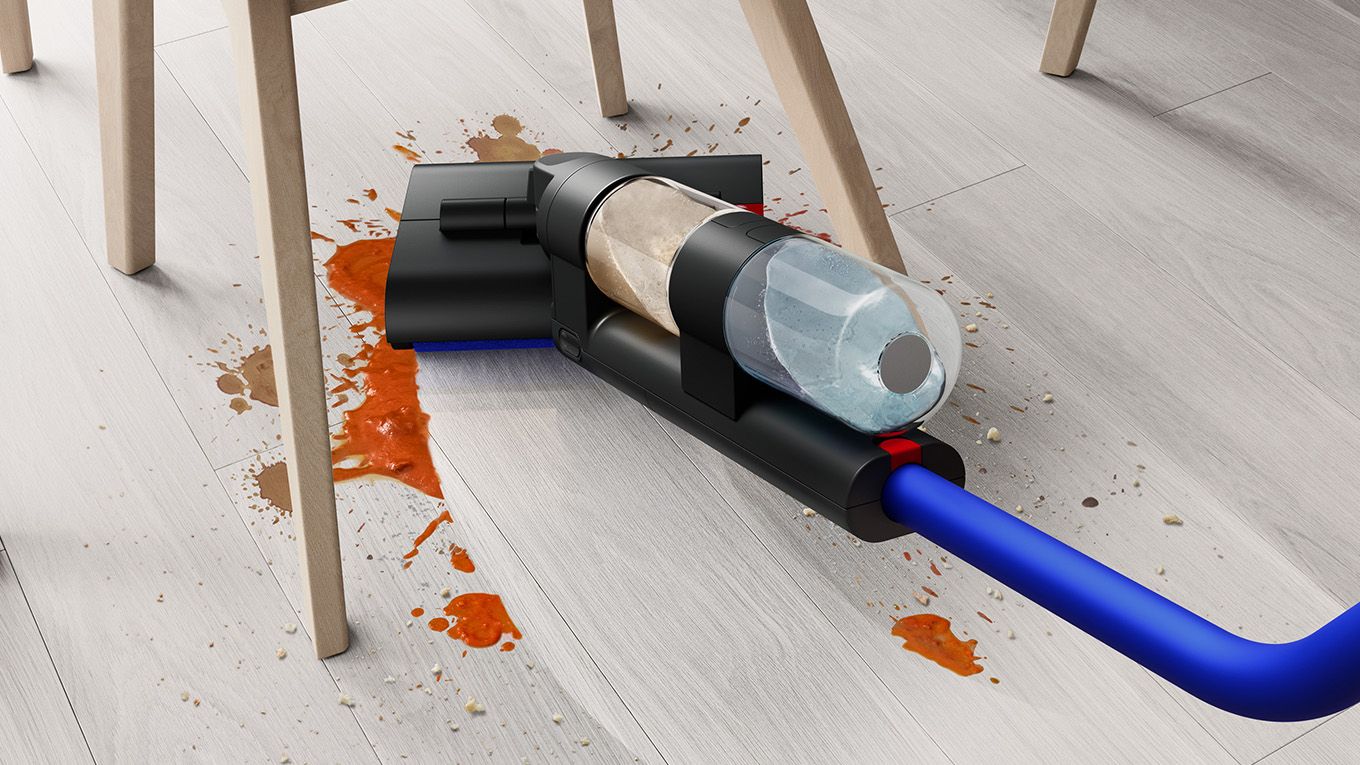 Dyson WashG1 used to clean up spill under a kitchen chair