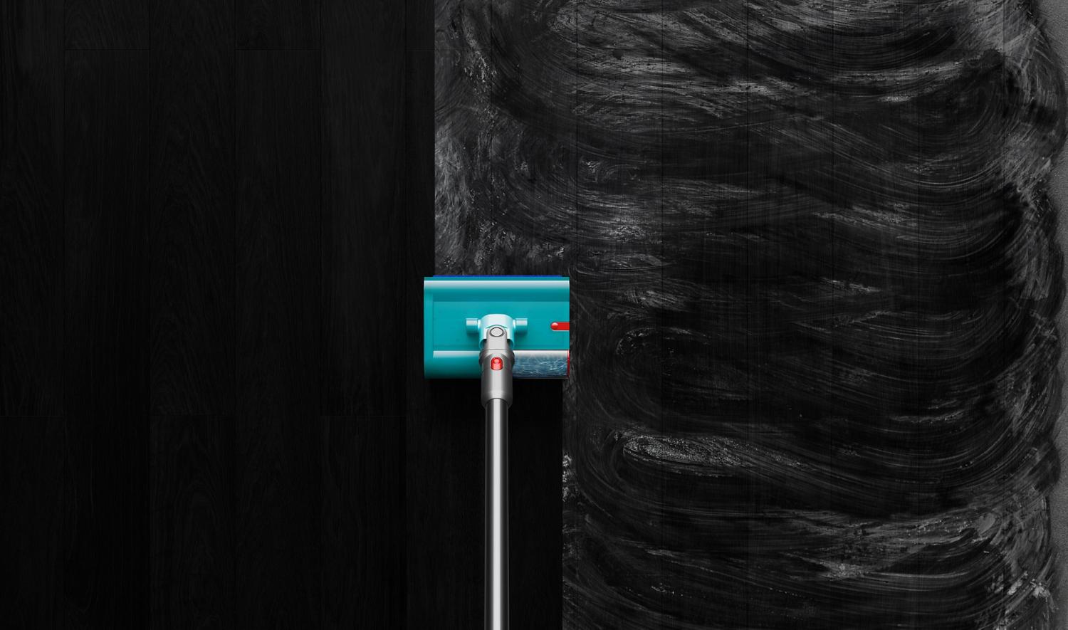 Dyson V15s Detect Submarine washing smeared dirt on black hard floor