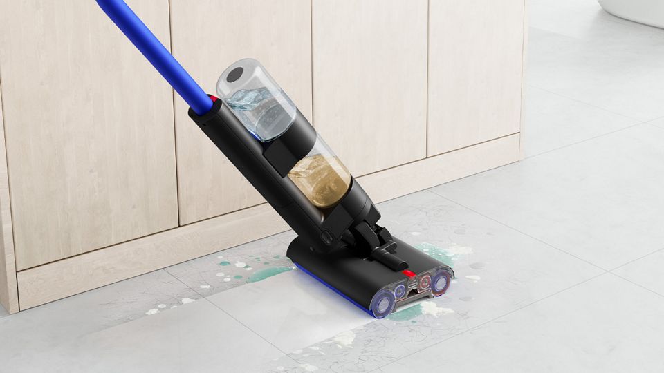 Dyson Submarine wet roller head used to clean bathroom floor by sink