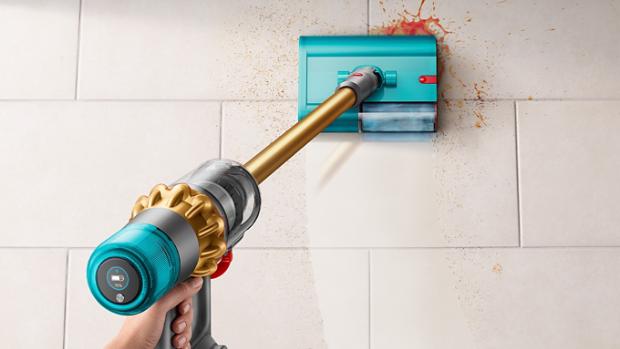 Dyson V15s Detect Submarine used to clean spill on kitchen tiled floor