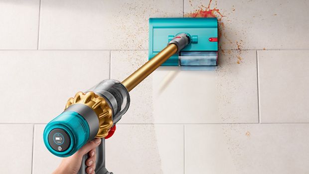 Dyson V15s Detect Submarine used to clean spill on kitchen tiled floor