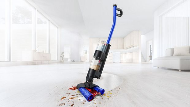 Dyson WashG1 wet cleaner used to clean dirt on living room hard floor
