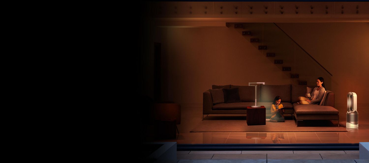 Home office with a Dyson Lightcycle task light and a Dyson Pure Cool Me purifying fan