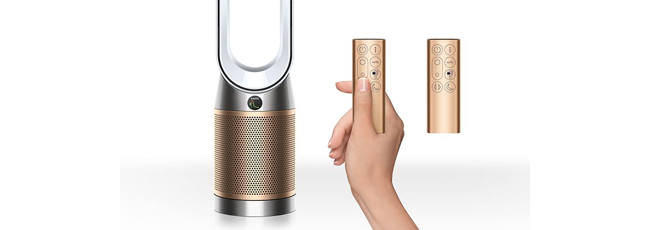 Dyson purifier next to two remote controls