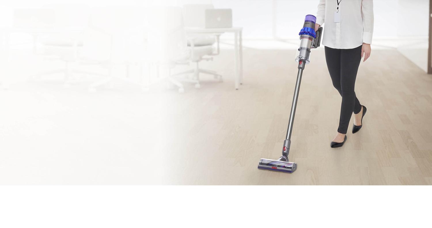 Man cleaning floor with Dyson V11 vacuum