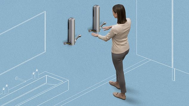Woman using Dyson Airblade to dry hands