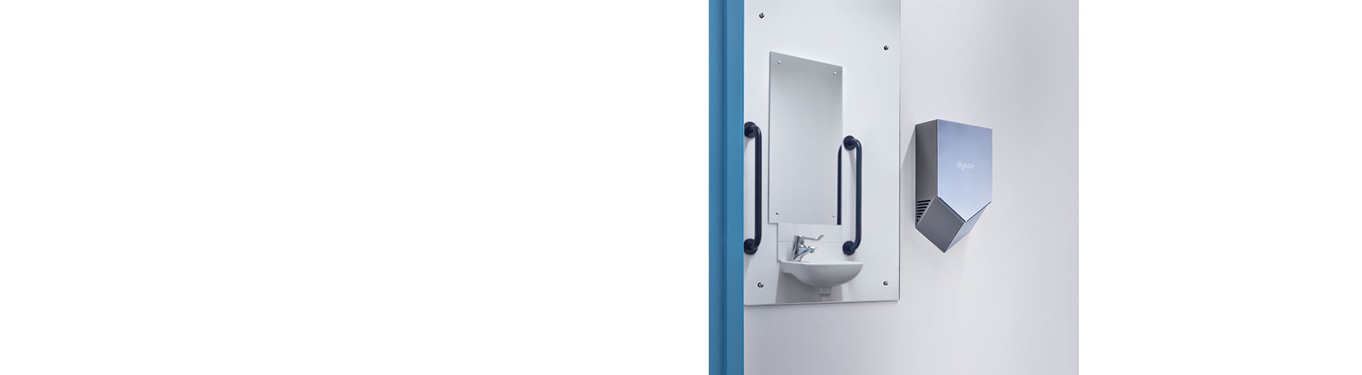 Dyson Airblade V Händetrockner in einem Waschraum montiert