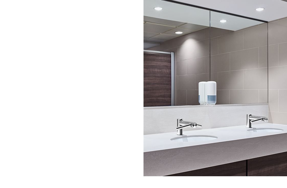 Two Dyson Airblade Wash+Dry taps in a bathroom