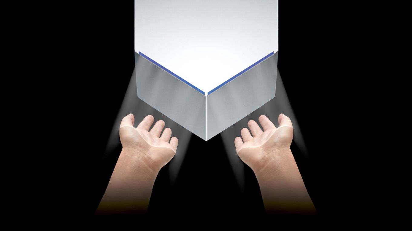 Hands being dried under Dyson Airblade V