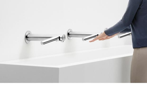 Woman using Dyson Airblade Wash+Dry