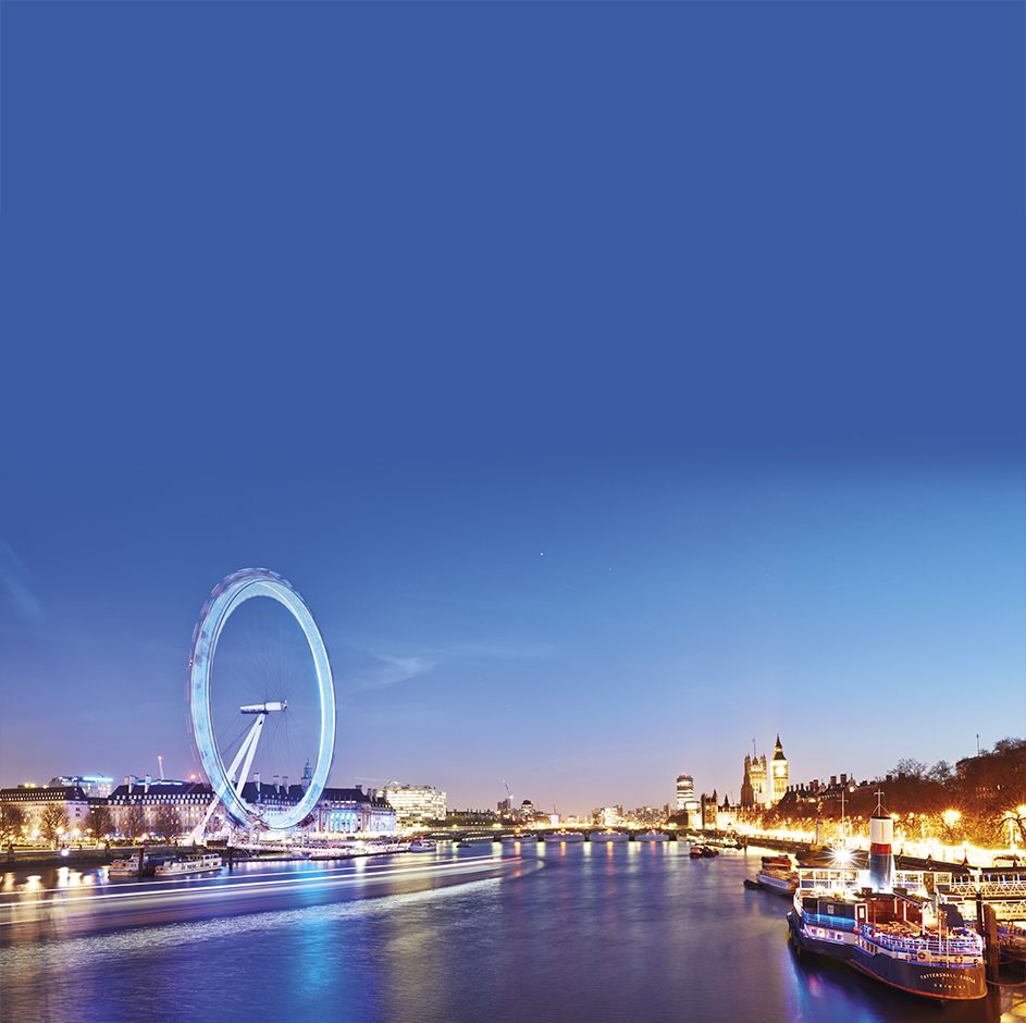 Coca-Cola London Eye beside The River Thames at dusk