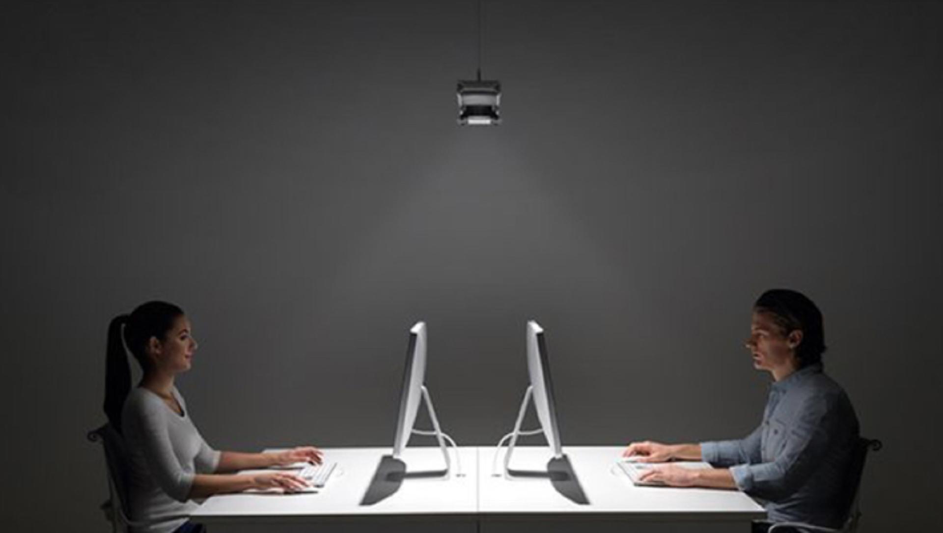 Two people working under light from Dyson cu-beam down lighting