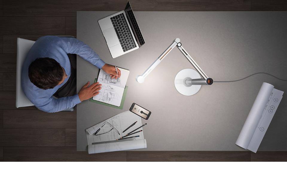 Dyson lights hanging over office desks