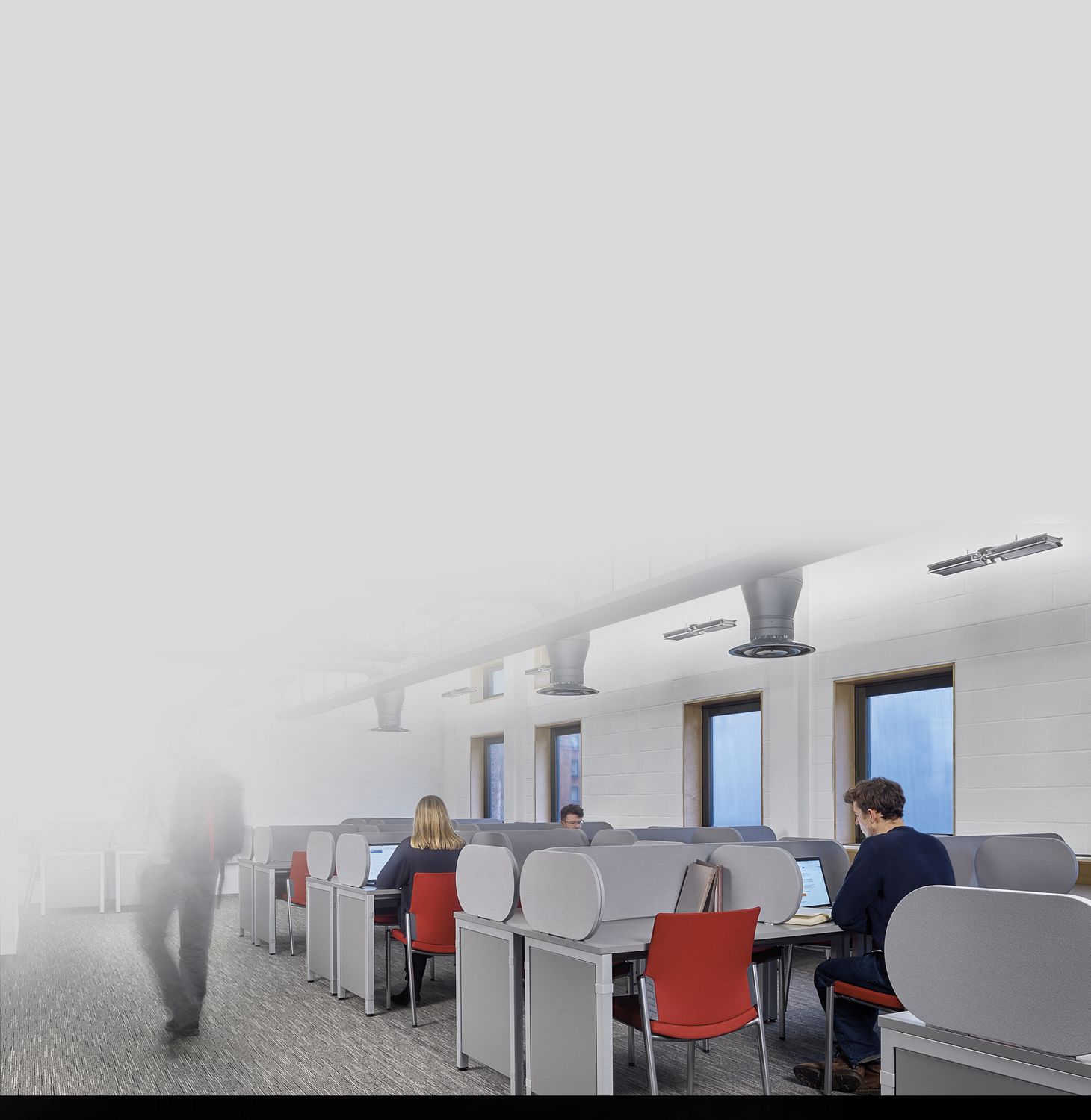 Students studying in student setting under Dyson Cu-Beam up lights