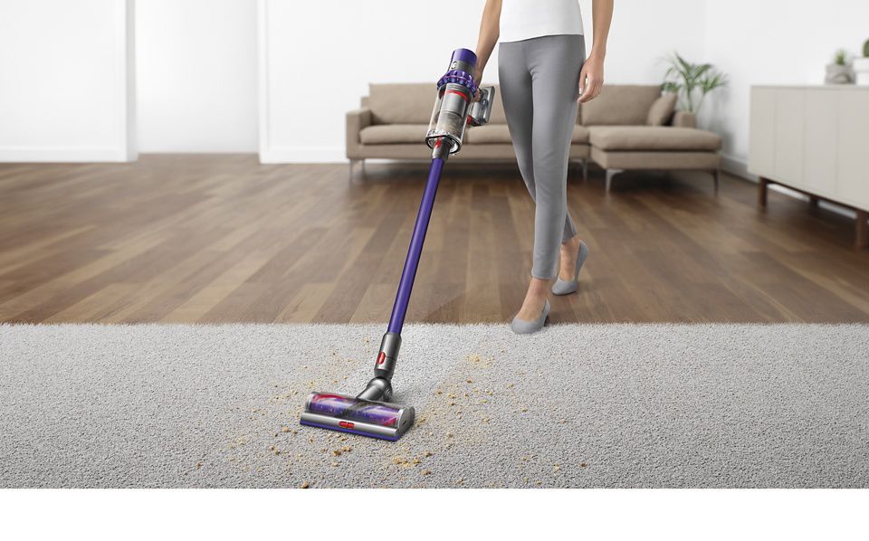 Dyson V10 vacuum cleaner lifting dirt from carpet