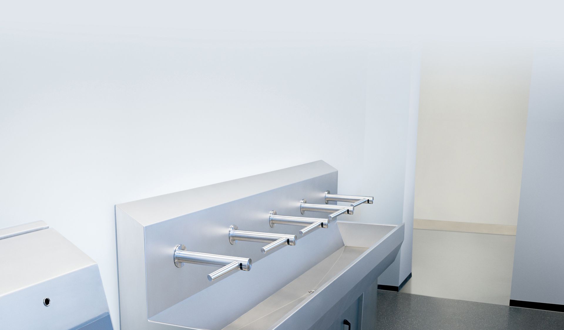Row of Airblade Taps in washroom 