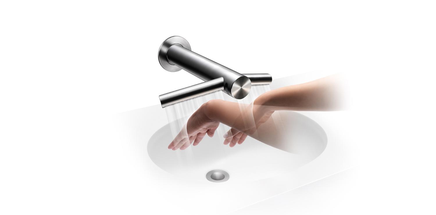 Hands under Dyson Airblade Tap hand dryer