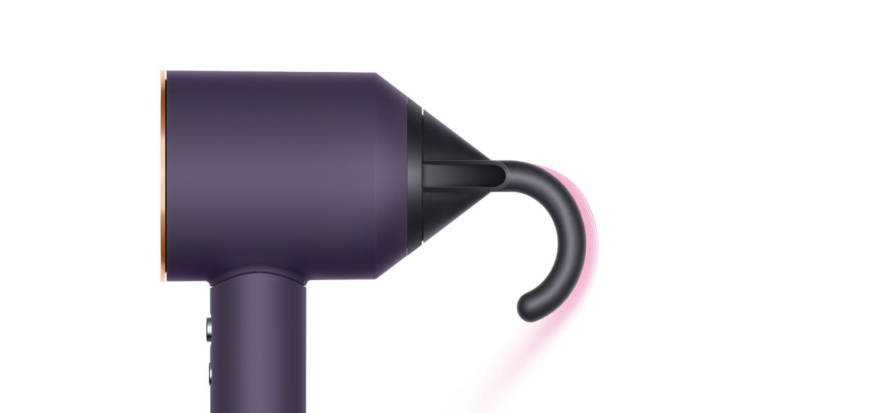 The Dyson Supersonic Professional hair dryer in Bright copper with the Flyaway attachment.