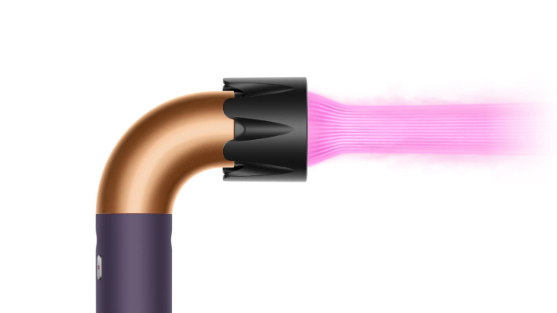 The Dyson Supersonic r Professional hair dryer in Bright copper with the Powerful air attachment.