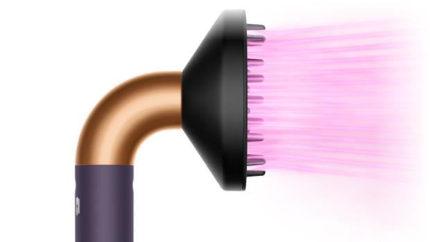 The Dyson Supersonic r Professional hair dryer in Bright copper with the Diffuser.