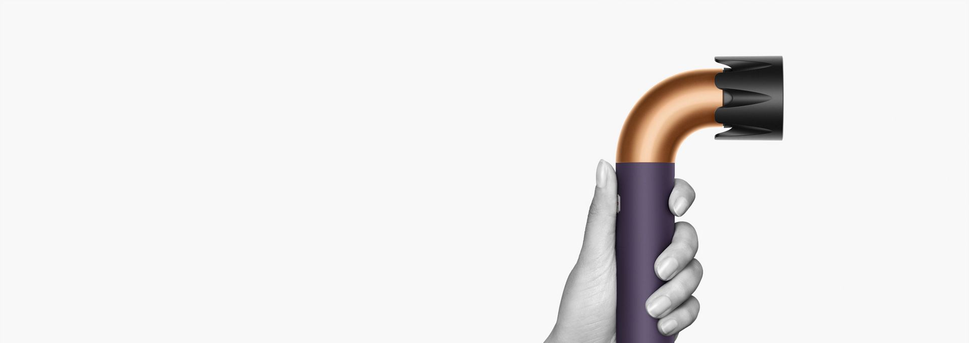 Hand holding the Dyson Supersonic r Professional hair dryer.