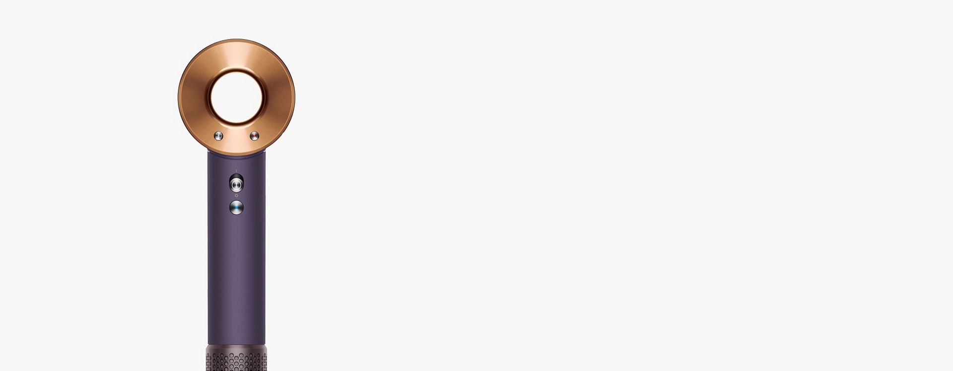 A stylist using the Dyson Supersonic Professional hair dryer in Bright copper.